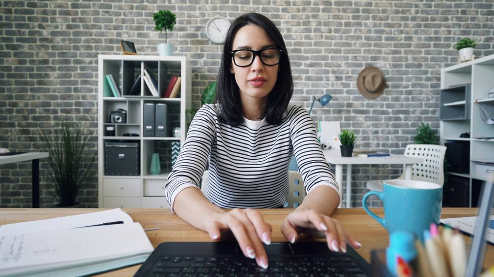 Online English teacher working at her laptop